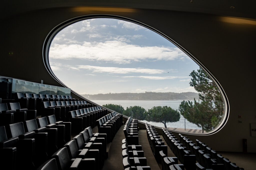 The empty auditorium at the Centro Cultural de Belem with the Tagus visible through the oval window